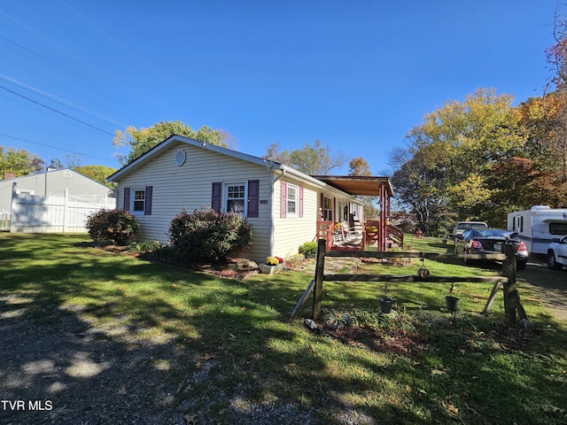 view of home's exterior featuring a lawn