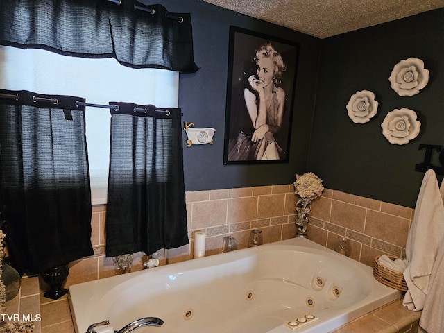 bathroom featuring a textured ceiling and a bathing tub