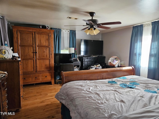 bedroom featuring light wood-type flooring and ceiling fan