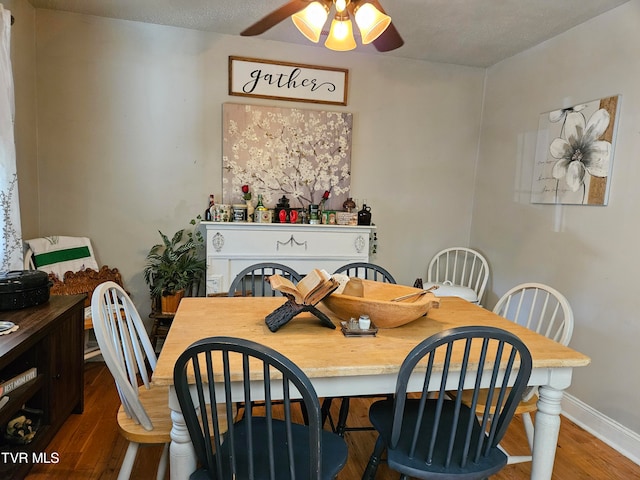 dining room featuring hardwood / wood-style floors and ceiling fan