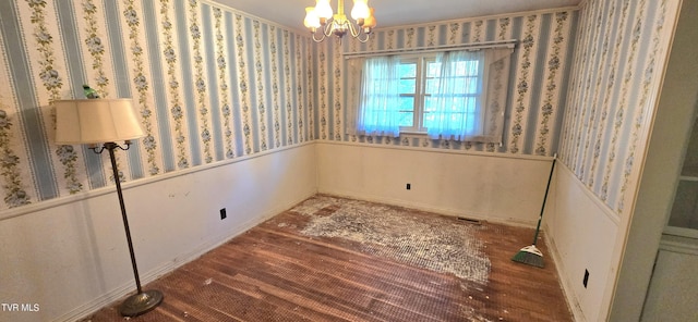 713 Woodhaven Dr, Johnson City, TN 37604 - interior space featuring wainscoting, wallpapered walls, wood finished floors, and a chandelier