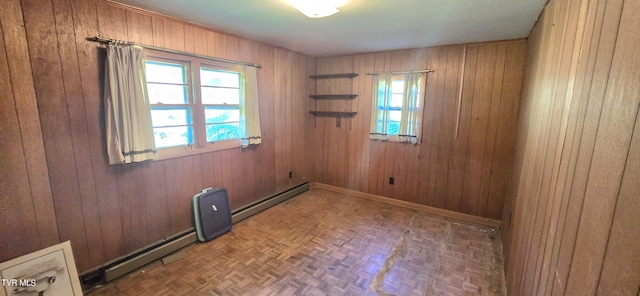 713 Woodhaven Dr, Johnson City, TN 37604 - unfurnished room with baseboard heating and wood walls