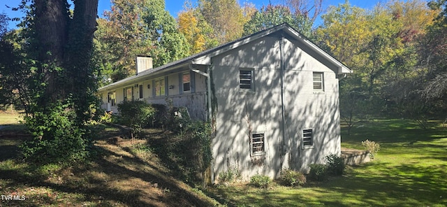 view of property exterior featuring a lawn