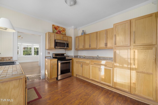 kitchen featuring dark hardwood / wood-style floors, sink, crown molding, light brown cabinetry, and appliances with stainless steel finishes