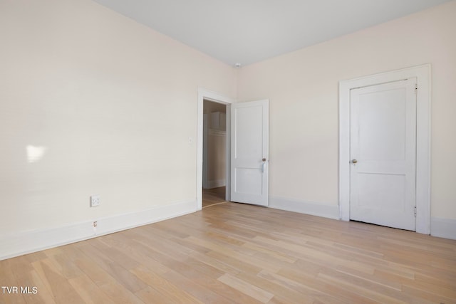 unfurnished room with light hardwood / wood-style floors