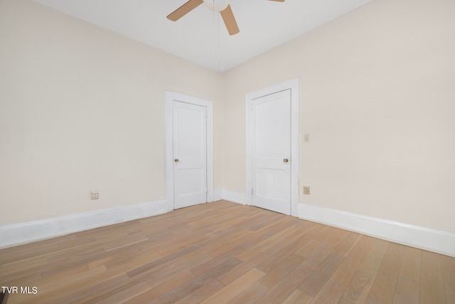 unfurnished room with hardwood / wood-style floors and ceiling fan