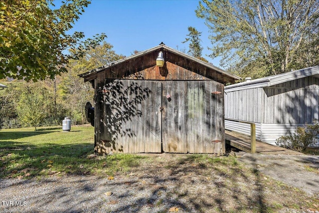 view of outdoor structure with a lawn