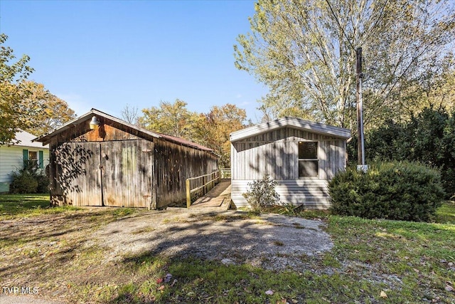 view of property exterior featuring an outdoor structure