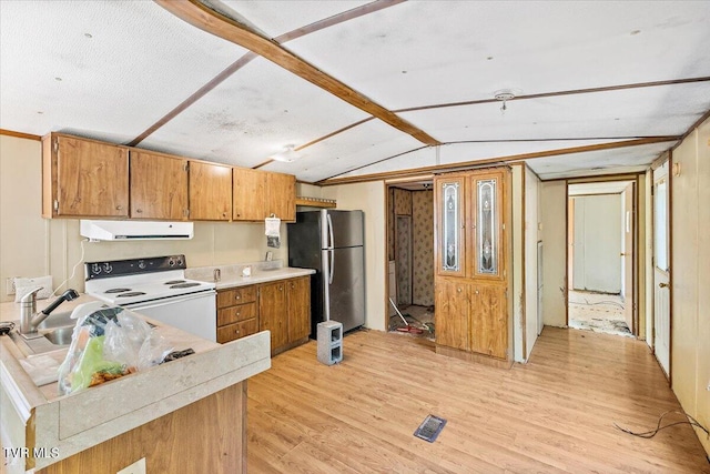 kitchen featuring white electric range oven, stainless steel refrigerator, vaulted ceiling with beams, light hardwood / wood-style flooring, and range hood