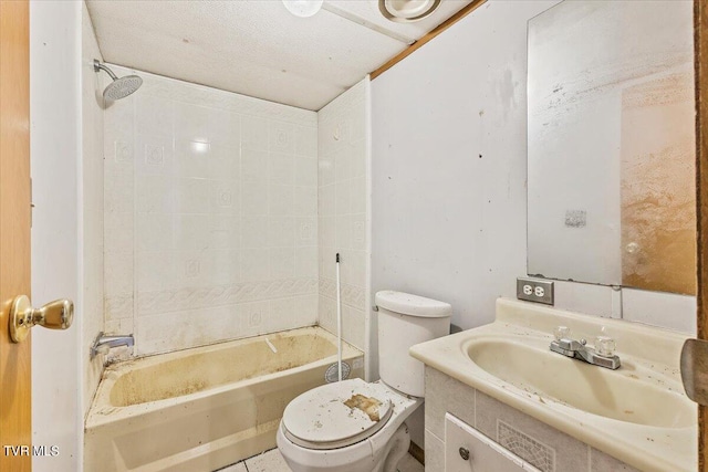 full bathroom featuring toilet, tiled shower / bath combo, and vanity