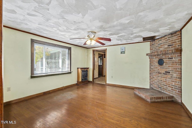 unfurnished living room featuring a textured ceiling, ceiling fan, heating unit, hardwood / wood-style flooring, and ornamental molding