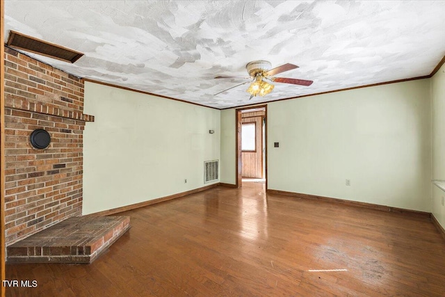 unfurnished living room featuring a textured ceiling, crown molding, hardwood / wood-style flooring, and ceiling fan