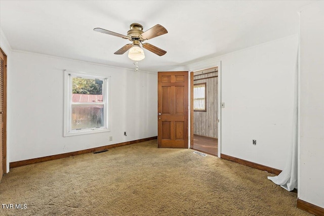 unfurnished bedroom with carpet and ceiling fan