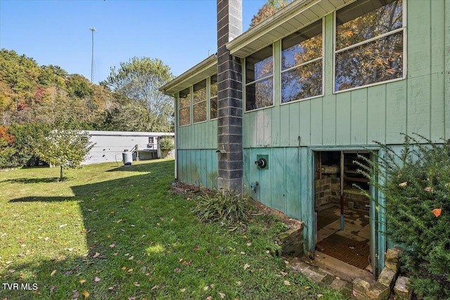 view of property exterior featuring a lawn