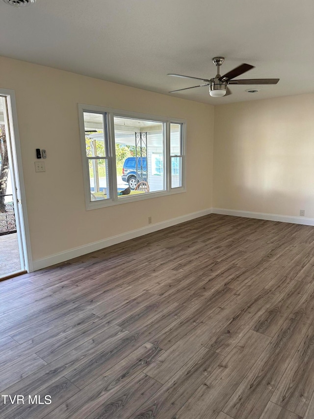 unfurnished room featuring ceiling fan and wood-type flooring