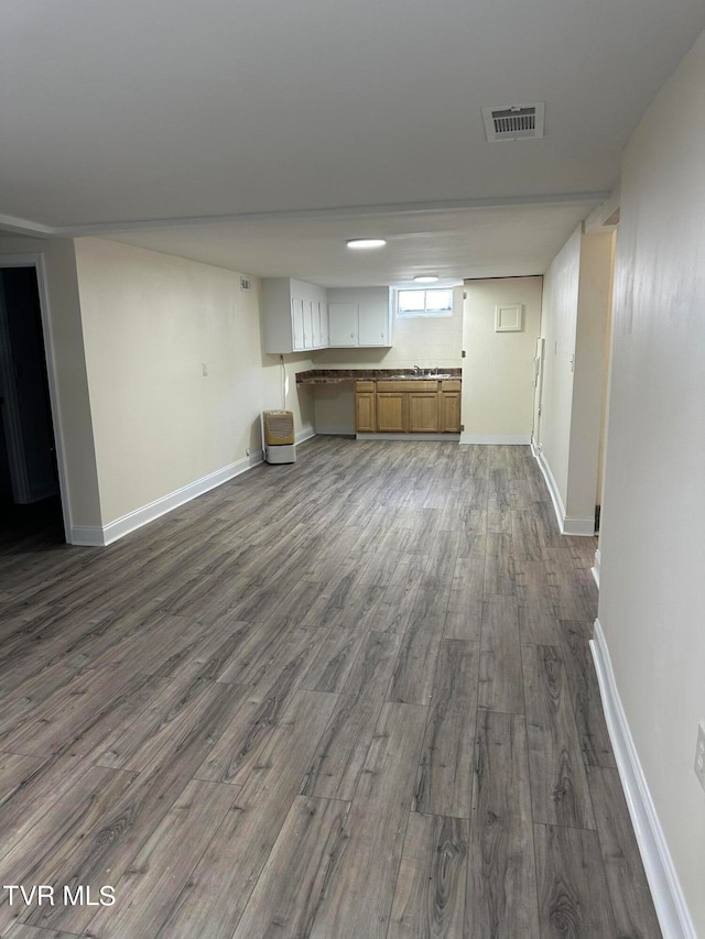 unfurnished living room with dark hardwood / wood-style floors