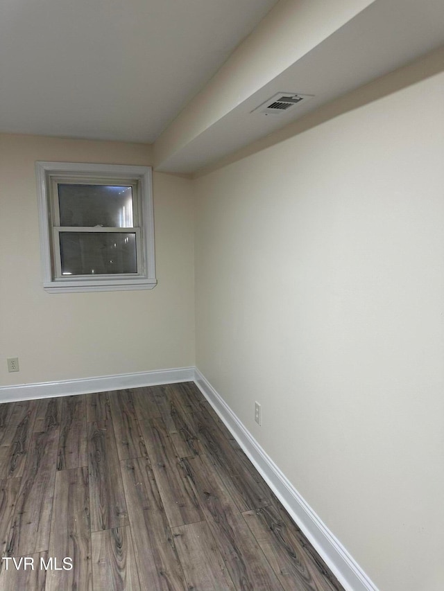 empty room featuring dark hardwood / wood-style floors