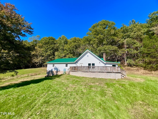 rear view of house with a lawn