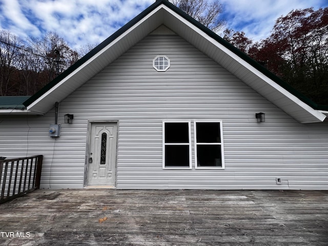 rear view of house with a wooden deck