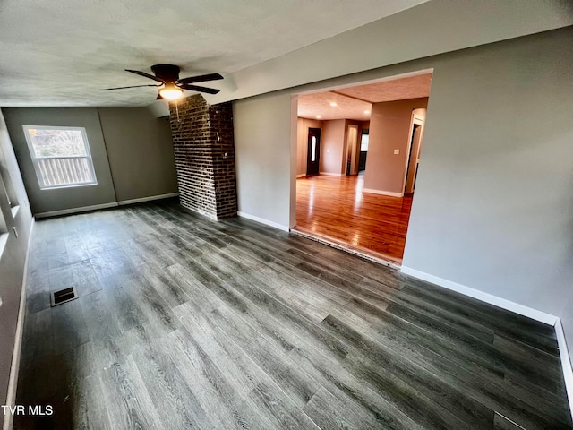 unfurnished living room with ceiling fan, wood-type flooring, a textured ceiling, and vaulted ceiling