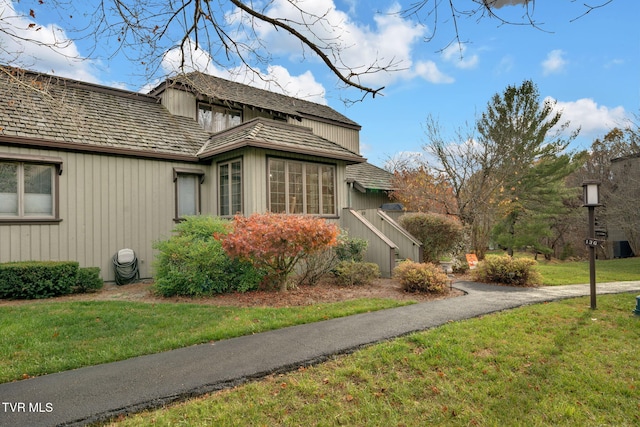 view of home's exterior featuring a lawn