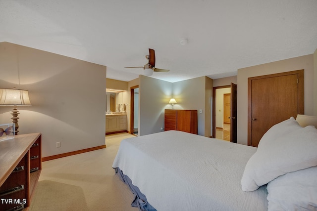 carpeted bedroom featuring ceiling fan and connected bathroom