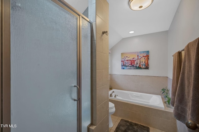 bathroom featuring tile patterned flooring, toilet, lofted ceiling, and plus walk in shower