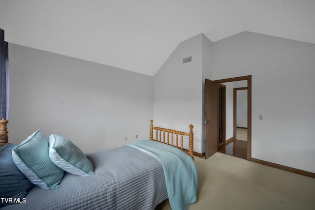 bedroom with carpet and lofted ceiling