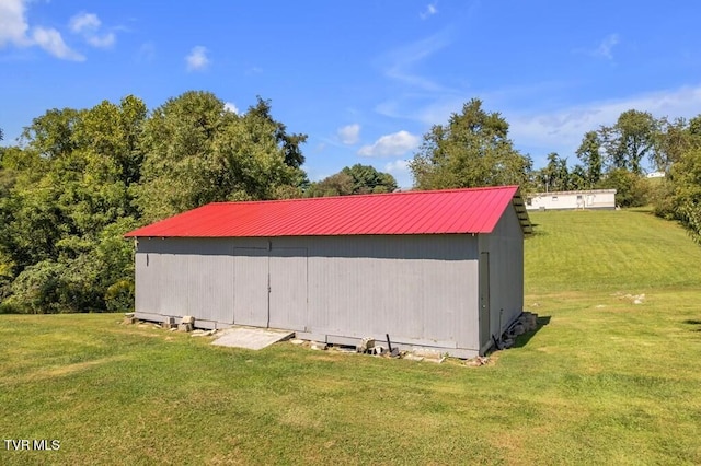 view of outdoor structure with a lawn