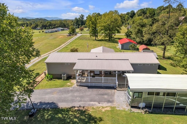 birds eye view of property with a mountain view