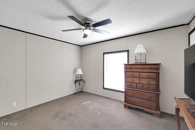 unfurnished bedroom featuring a textured ceiling and ceiling fan