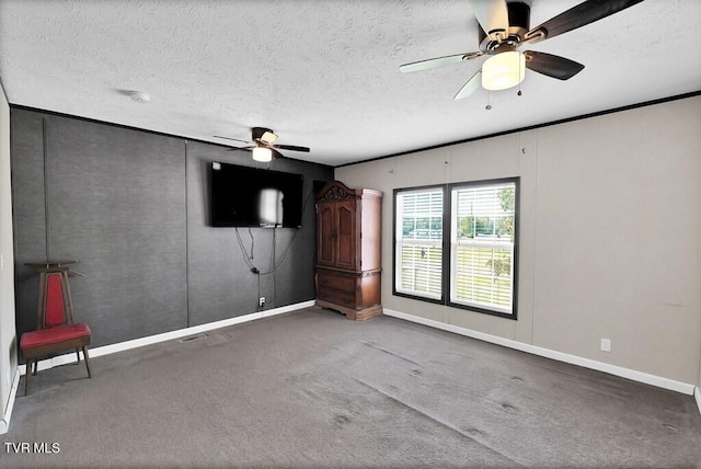 interior space featuring a textured ceiling and ceiling fan