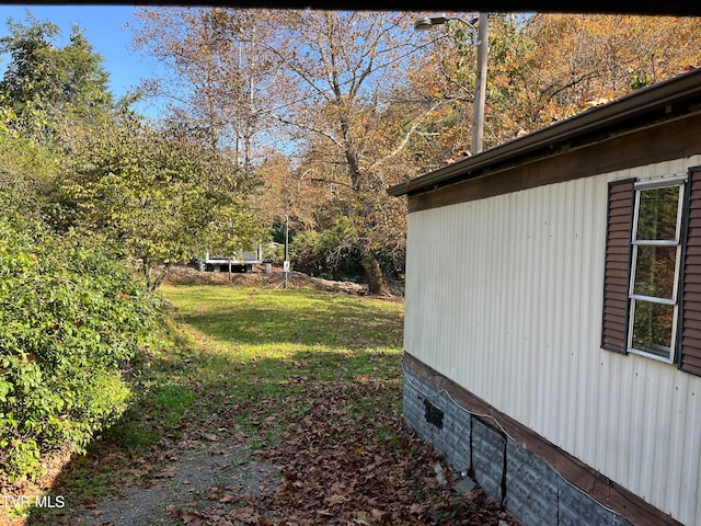 view of home's exterior with a lawn