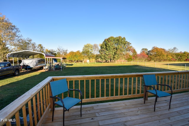 deck with a yard and a carport