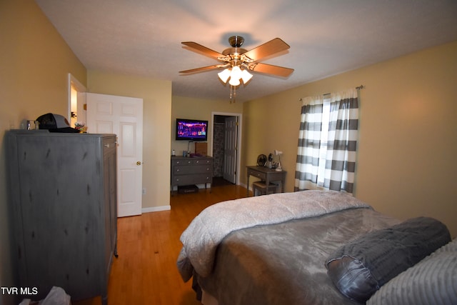 bedroom with light wood-type flooring and ceiling fan