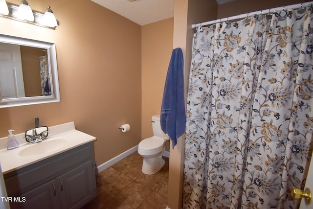 bathroom featuring vanity, toilet, a shower with shower curtain, and tile patterned flooring