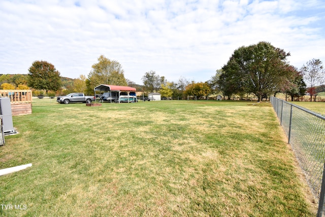 view of yard featuring a carport