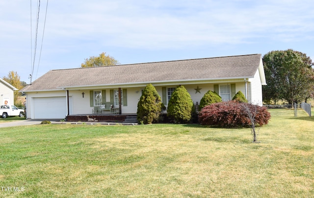 single story home featuring a front yard, a garage, and a porch