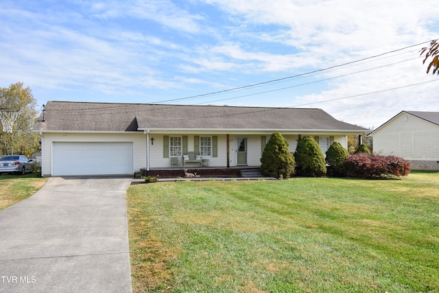 ranch-style house with a front yard, covered porch, and a garage