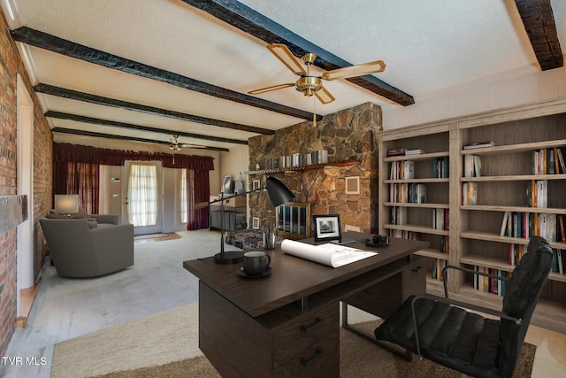 office featuring beamed ceiling, ceiling fan, and a textured ceiling