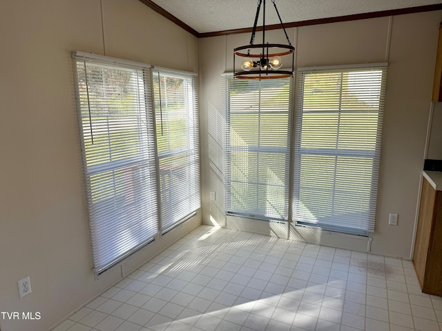 unfurnished dining area with vaulted ceiling, a textured ceiling, and light tile patterned floors