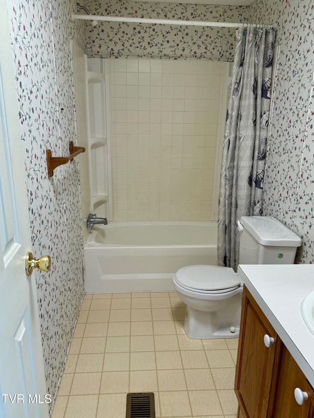 full bathroom with toilet, shower / tub combo with curtain, vanity, and tile patterned flooring