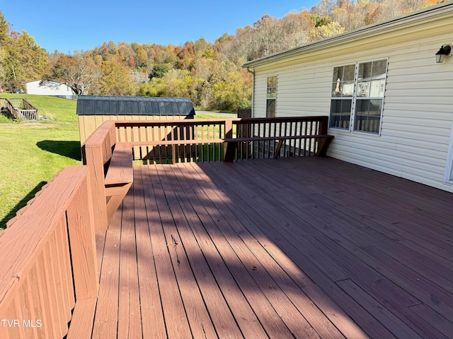 deck featuring a lawn