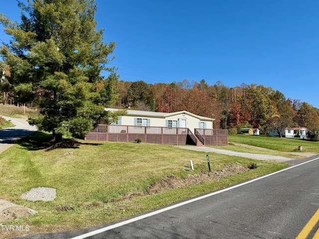 4527 Dorchester Rd, Norton, VA 24273 - manufactured / mobile home featuring a front lawn, a deck, and stairs
