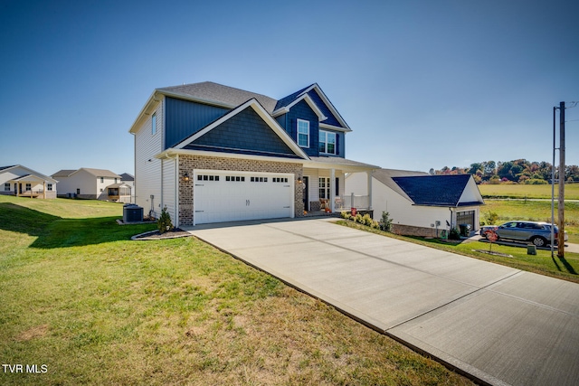 craftsman-style house with central AC, a front yard, a garage, and covered porch