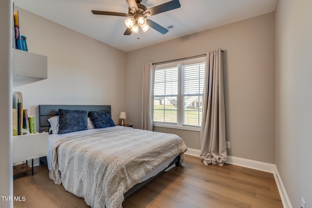 bedroom featuring light wood-type flooring and ceiling fan