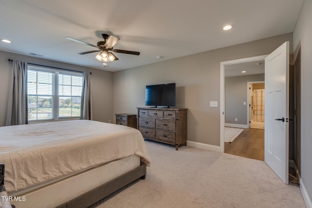 bedroom featuring light carpet and ceiling fan