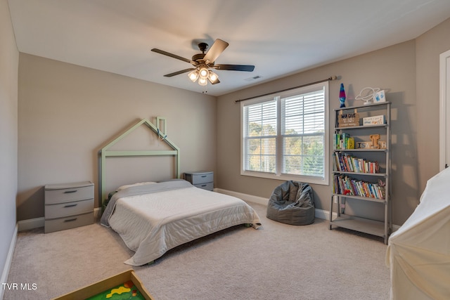 bedroom with light carpet and ceiling fan