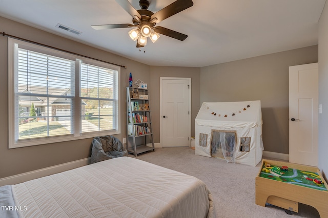 carpeted bedroom featuring ceiling fan