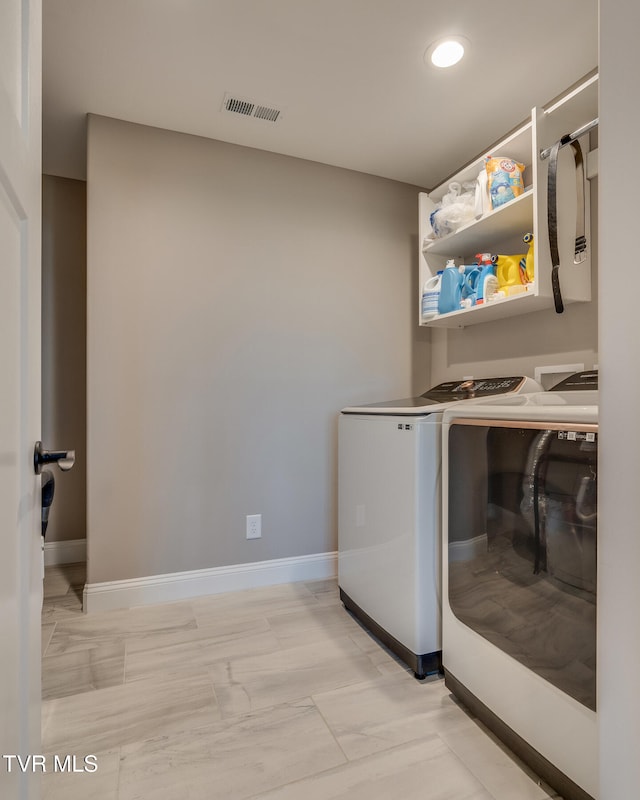 laundry area featuring washing machine and dryer